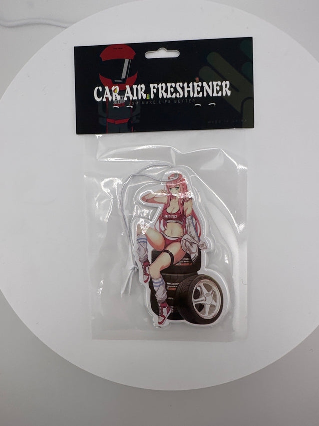 Cute anime waifu sitting on tire’s air freshener - Chicano Spot